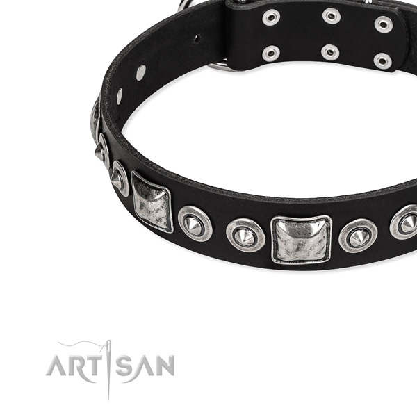 Snugly fitted leather dog collar with resistant rust-proof hardware